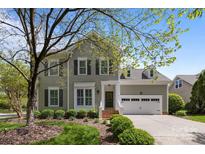 Charming two-story home featuring manicured landscaping, a two-car garage, and classic architectural details at 801 Celbridge Ct, Charlotte, NC 28270