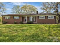 Charming single-story brick home with a well-maintained lawn and inviting curb appeal at 70 Liberty Church Rd, Taylorsville, NC 28681