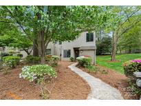 Charming townhome featuring a quaint walkway, colorful landscaping and a lush green tree at 181 Riverview Ter, Clover, SC 29710