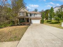 Charming two-story home with a two-car garage and well-maintained landscaping at 1907 Caprington Dr, Fort Mill, SC 29707