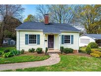 Charming single-story home featuring a well-manicured lawn and cozy front porch at 713 8Th Street Nw Dr, Hickory, NC 28601