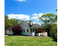 Charming one-story home boasts a welcoming porch and a lush, landscaped yard at 3032 Mckinney Rd, Shelby, NC 28152