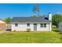 Charming single-story home with a well-maintained lawn and classic white siding at 1153 Doris Ct, Rock Hill, SC 29730