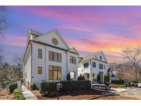 Stunning white brick home showcases modern architectural design and lush landscaping at 728 Brookside Ave, Charlotte, NC 28203