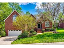 Charming brick home with a well-maintained front yard and a two car garage at 1126 Blowing Rock Cv, Fort Mill, SC 29708