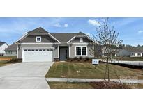 Charming single-story home with a two-car garage and manicured lawn, perfect for comfortable living at 2229 Camber Dr # Cwo0100, Gastonia, NC 28054