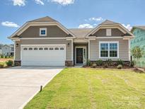 Charming single-Gathering home with a well-manicured lawn, a two-car garage, and a welcoming entrance at 2229 Camber Dr # Cwo0100, Gastonia, NC 28054
