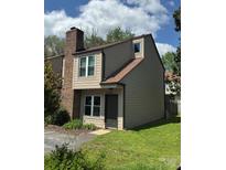 Two story home with neutral siding, chimney and well-manicured lawn at 2335 Brookview Ct, Rock Hill, SC 29732