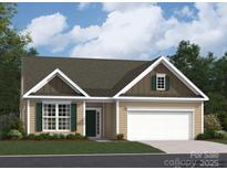 Charming one-story home featuring a two-car garage, complemented by mature trees, a well-manicured lawn, and tasteful green shutters at 2820 Morning Song Way, Lancaster, SC 29720