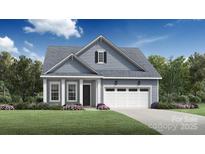 Charming single-Gathering home featuring a well-manicured lawn and attached two car garage at 5325 Mint Harbor Way # 0309, Charlotte, NC 28269