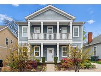 Charming two-story home with a welcoming front porch and well-maintained landscaping at 612 Baldwin Ave, Charlotte, NC 28204