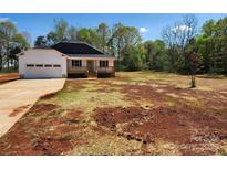 Charming single-story home with a covered front porch and an attached two-car garage on a spacious lot at 4168 S Olivers Cross Rd # 6, Newton, NC 28658