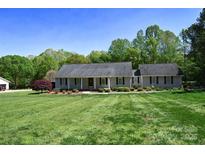 Charming single-story home with a well-manicured lawn and tasteful landscaping at 6779 Highway 557 Hwy, Clover, SC 29710