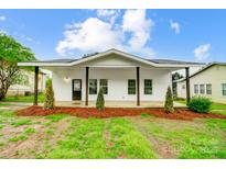 Charming renovated home with a welcoming front porch and new landscaping at 113 Woodside Ave, Gastonia, NC 28054