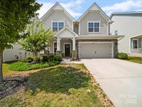 Charming two-story home with manicured lawn and stone accents, creating a welcoming curb appeal at 3042 Burnello Ct, Iron Station, NC 28080