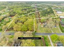 Aerial perspective of a 27-acre wooded lot with approximate boundaries marked, including utility easement at 322 S Main St, Shelby, NC 28152