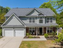 Charming two-story home featuring a two-car garage, brick accents, and mature landscaping at 3901 Parkers Fry None, Fort Mill, SC 29715