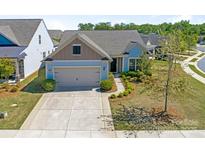 Beautiful single-Gathering home featuring a two-car garage, manicured lawn, and charming curb appeal at 804 Birdsong Way, Fort Mill, SC 29715