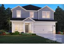 Charming two-story home featuring a two-car garage and a beautifully landscaped front yard at 142 Aberdeen Dr, Salisbury, NC 28144