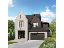 Charming two-story home with a mix of brick and wood siding, a dark roof, and a well-manicured front yard at 4105 Walker Rd, Charlotte, NC 28211