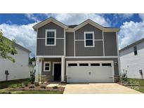 Charming two-story home with a two-car garage and beautiful gray siding at 812 Blue Canyon Dr, York, SC 29745