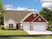 New construction featuring a charming home with a 2-car garage, stone accents, and a well-manicured lawn at 4109 Camden Glen Rd, Lancaster, SC 29720