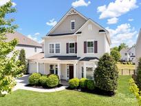 Charming two-story home with landscaped yard, covered porch, and attached two car garage at 79411 Ridgehaven Rd, Indian Land, SC 29720