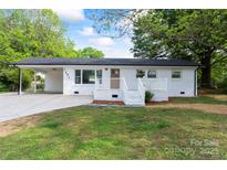Charming, freshly painted single-story home with a covered carport and welcoming front porch at 1341 Hopewell Rd, Rock Hill, SC 29730