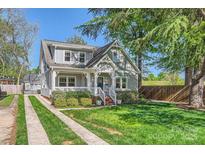 Charming two-story home with a welcoming front porch and well-maintained landscaping at 3709 Commonwealth Ave, Charlotte, NC 28205