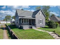 Attractive single-Gathering home with a well-maintained lawn, covered porch, and grey painted siding at 71 14Th Se St, Hickory, NC 28602