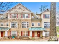 Charming townhouse with well-maintained landscaping and inviting front porch at 1745 Matheson Ave, Charlotte, NC 28205