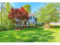 Charming two-story home with a beautiful lawn and mature trees at 2166 Potpourri Pt, Rock Hill, SC 29732