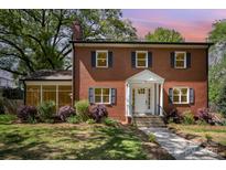 Charming brick home featuring a well-manicured lawn and an inviting entrance at 45 Mckinnon Ne Ave, Concord, NC 28025