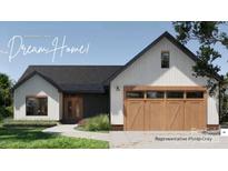 Charming modern farmhouse exterior featuring a welcoming entrance and stylish garage door at 169 Hickory Grove Rd, Harmony, NC 28634