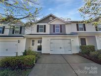 Charming townhouse with well-maintained landscaping, attached garage, and inviting curb appeal at 3357 Ellingford Rd, Charlotte, NC 28214