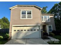 Charming two-story home featuring a two-car garage, landscaped yard, and classic architectural details at 4219 Shasta Cir, Clover, SC 29710