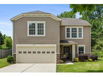 Charming two-story home with a well-manicured lawn, neutral siding, and a two-car garage, creating a welcoming curb appeal at 4219 Shasta Cir, Clover, SC 29710