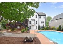 A charming home featuring a private pool, screened in porch, and a well-manicured backyard at 1811 Robbins Meadows Dr, Waxhaw, NC 28173