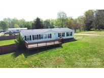 Charming single-story home with a cozy front porch and well-maintained lawn at 2055 Cauble Rd, Salisbury, NC 28144