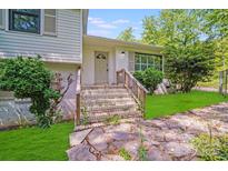 Inviting front entrance with brick steps and stone pathway leading to a charming home at 4915 Huntington Farm Rd, Catawba, SC 29704
