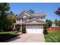 Charming two-story home with a well-manicured lawn, stone accents and a two-car garage at 739 Ivy Trail Way, Fort Mill, SC 29715
