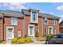 Charming brick townhome featuring a modern architectural style and well-maintained landscaping at 2638 Dilworth Heights Ln, Charlotte, NC 28209