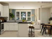 Modern kitchen featuring white cabinets, stainless steel appliances, an island with stool seating, and lots of natural light at 4539 Potters Wheel Dr, Fort Mill, SC 29715