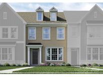 Charming two-story townhome featuring dormer windows and a well-manicured front lawn at 4543 Potters Wheel Dr, Fort Mill, SC 29715
