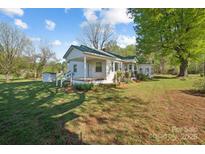 Charming single-story home with a large front yard and inviting front porch at 2679 Providence Mill Rd, Maiden, NC 28650