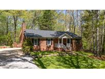 Well-maintained brick home with manicured lawn and classic black shutters at 4289 Falcon Hall Way, Rock Hill, SC 29730