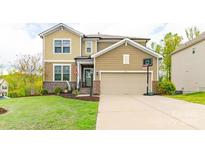 Charming two-story home with a well-manicured lawn, two car garage and a basketball hoop at 807 Oak Manor Se Dr, Concord, NC 28025
