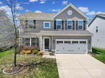 Charming two-story home with landscaped yard and two car garage at 1717 Mill Creek Sw Ln, Concord, NC 28025