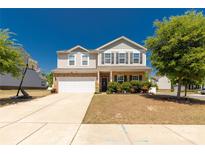 Charming two-story home featuring a well-maintained front yard and attached two car garage at 269 Keating Place Dr, Fort Mill, SC 29708