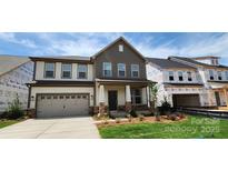 Charming two-story home with stone accents, attached garage and inviting front porch at 642 Amberjack Pl # 75, York, SC 29745